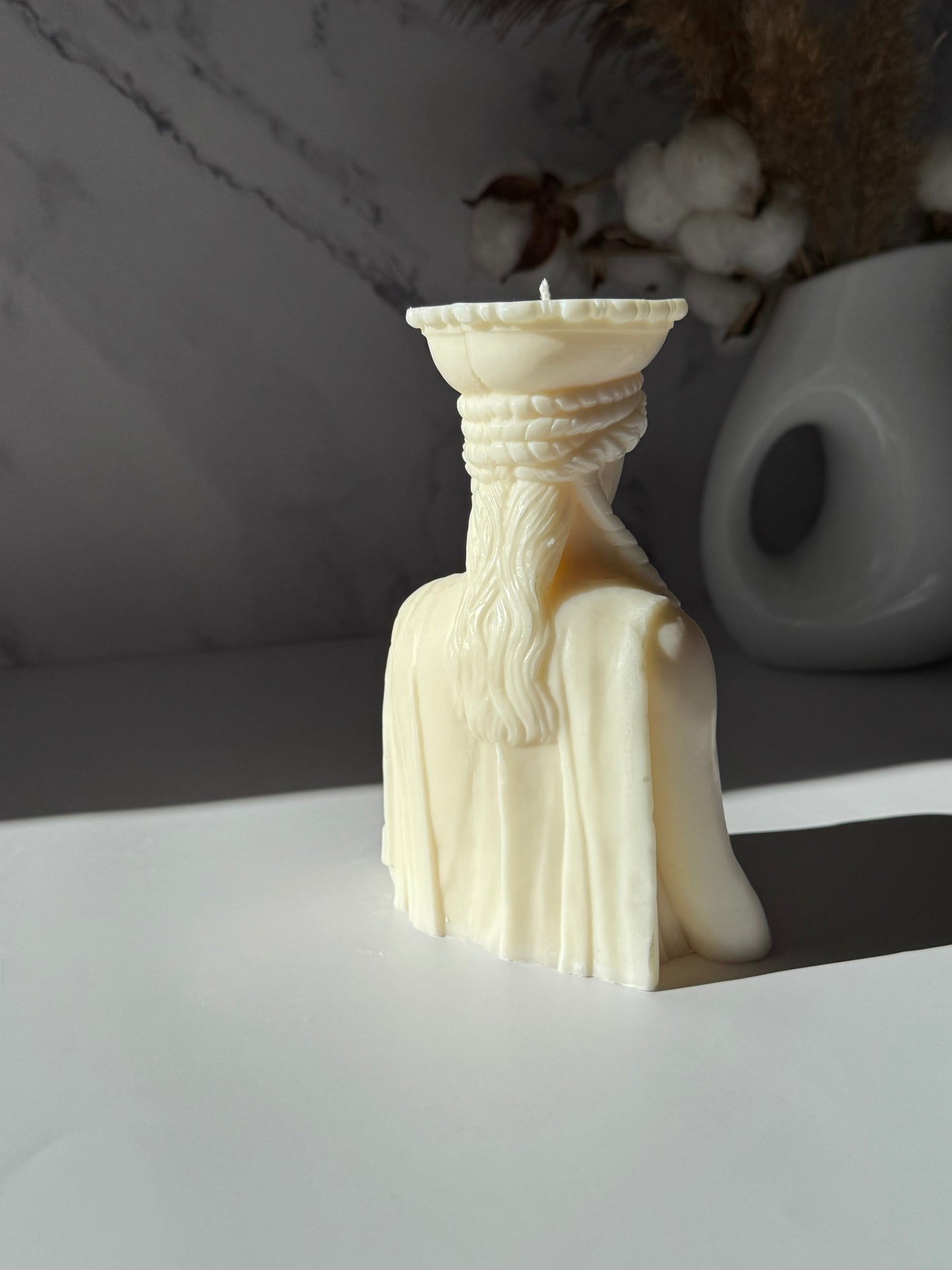 CARYATIDS on a candle
